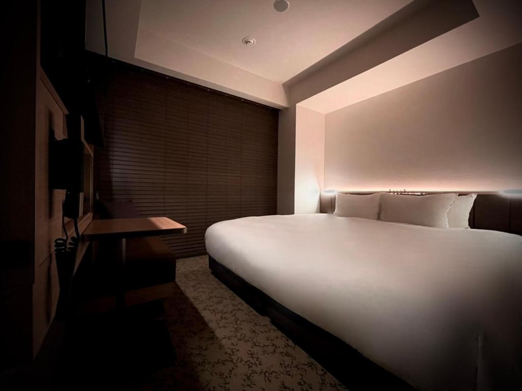 Postel nebo postele na pokoji v ubytování Nest Hotel Tokyo Hanzomon