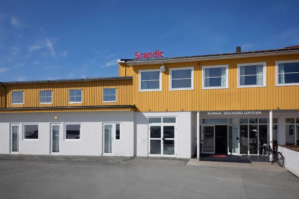 a building with a sanchez sign on top of it at Scandic Vestfjord Lofoten in Svolvær