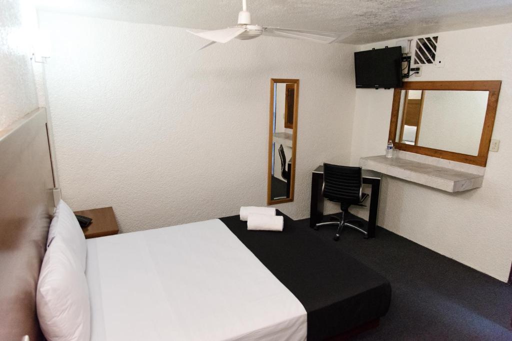 Postel nebo postele na pokoji v ubytování Hotel Central Irapuato - Hotel en Irapuato