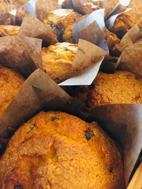 a pile of muffins sitting in a box at Hotel Milanese in Rimini