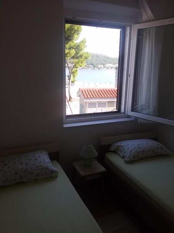 Postel nebo postele na pokoji v ubytování Guesthouse Dante