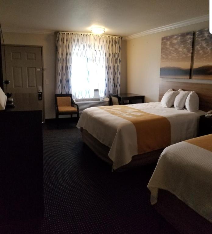 Postel nebo postele na pokoji v ubytování Days Inn by Wyndham Winnemucca