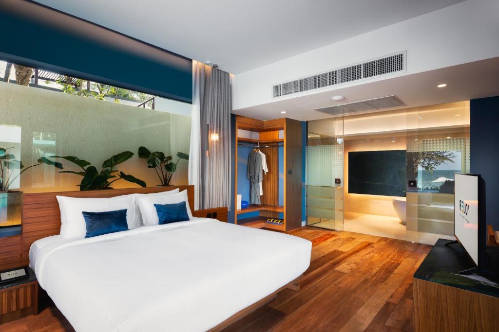 Postel nebo postele na pokoji v ubytování RELO' The Urban Escape - Huahin
