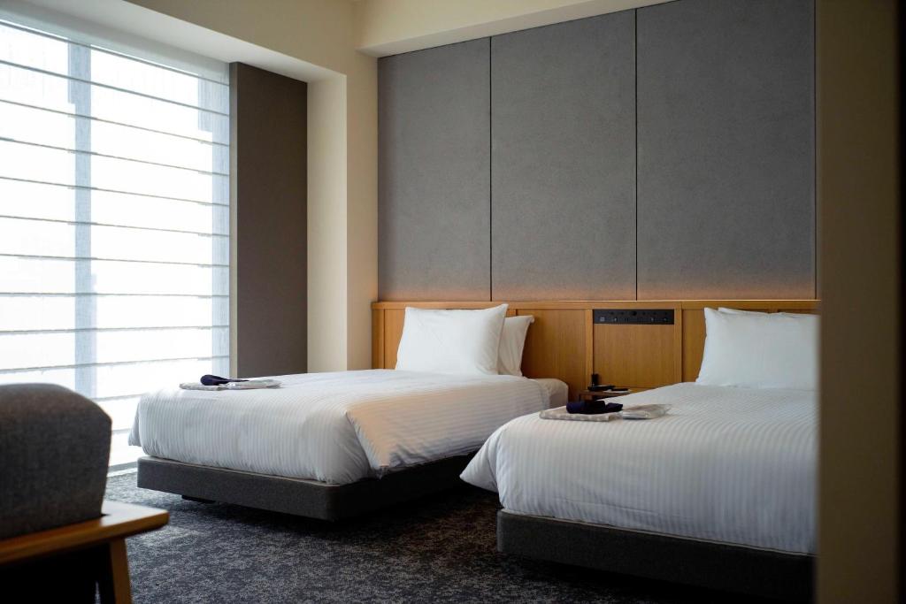 Postel nebo postele na pokoji v ubytování Park Hotel Kyoto
