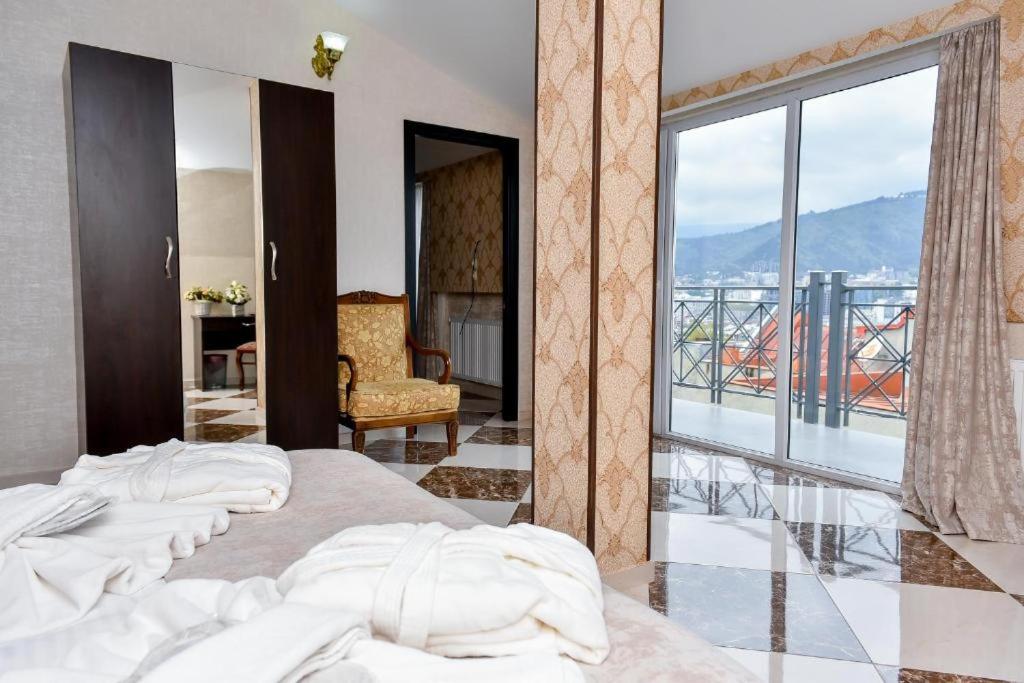Postel nebo postele na pokoji v ubytování MariaLuis Hotel
