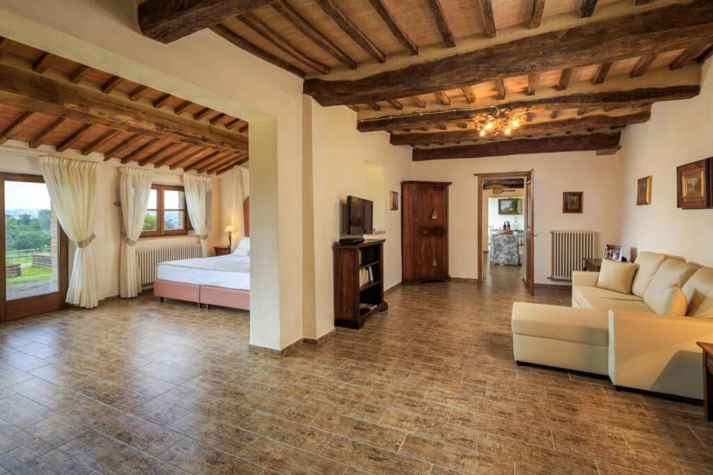 A bed or beds in a room at Podere Maiano - Private pool villa with spa