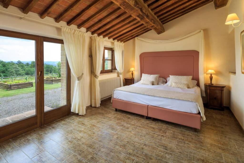 A bed or beds in a room at Podere Maiano - Private pool villa with spa