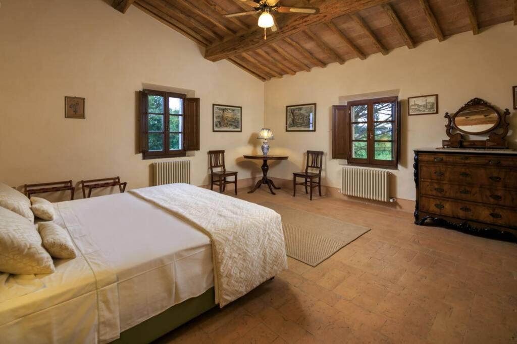 A bed or beds in a room at Podere Maiano - Private pool villa with spa