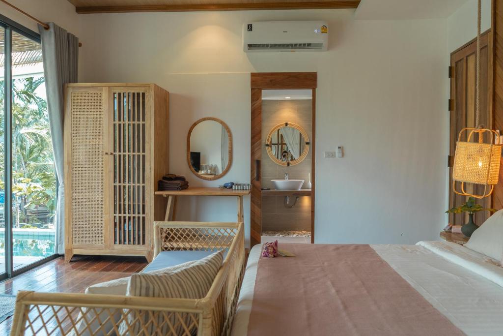 Postel nebo postele na pokoji v ubytování The Spa Koh Chang Resort