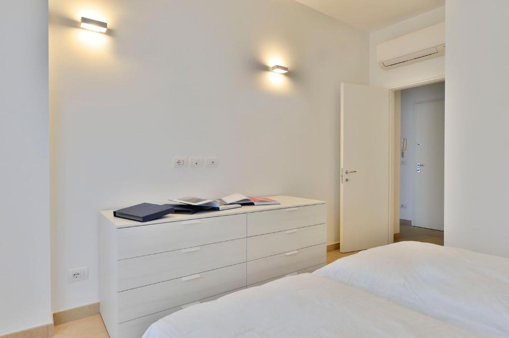 A bed or beds in a room at UR-NEST Galleria del Toro