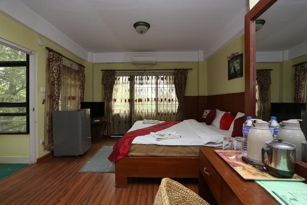 Postel nebo postele na pokoji v ubytování New Hotel Panda