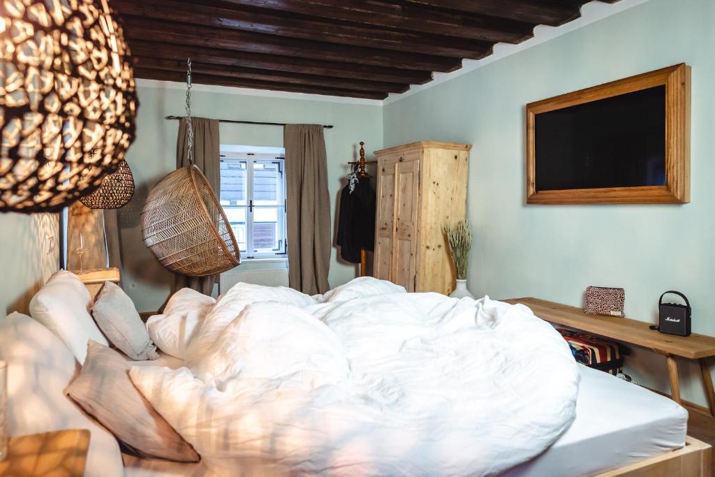 Postel nebo postele na pokoji v ubytování Der Steinerwirt - hangout & hotel