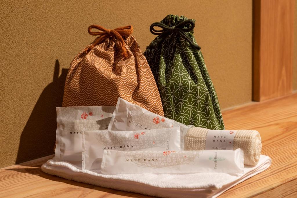 two bags sitting on top of a table at 祇園の宿 杏花 in Kyoto