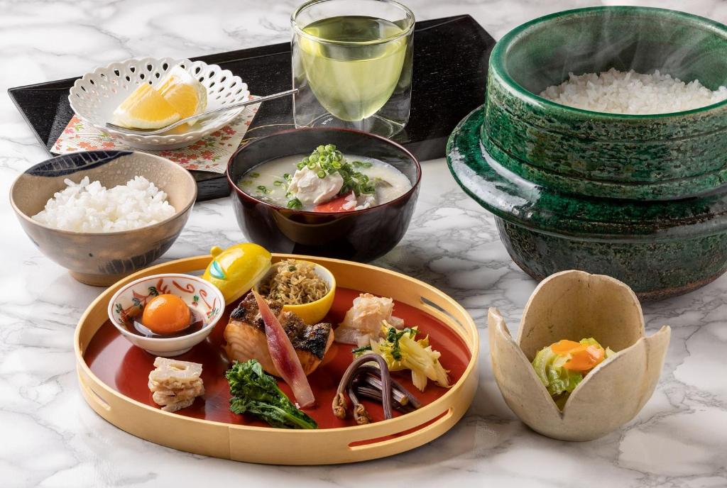 a plate of food on a table with rice at 祇園の宿 杏花 in Kyoto