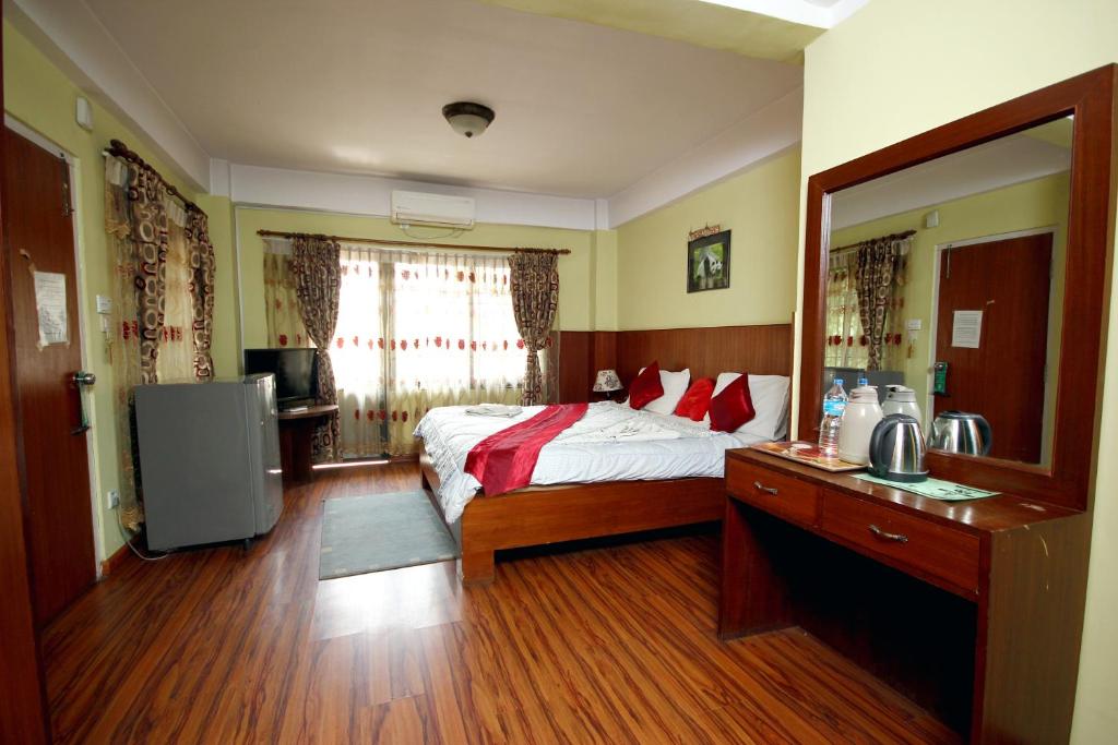 Postel nebo postele na pokoji v ubytování New Hotel Panda