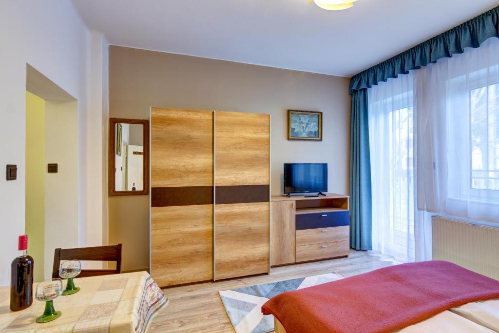 Posteľ alebo postele v izbe v ubytovaní Gyapay Apartman Hévíz