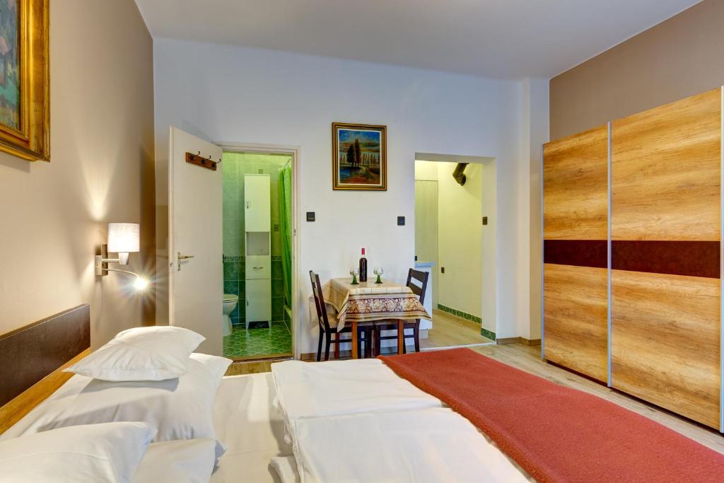 Posteľ alebo postele v izbe v ubytovaní Gyapay Apartman Hévíz