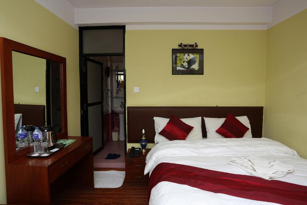 Postel nebo postele na pokoji v ubytování New Hotel Panda