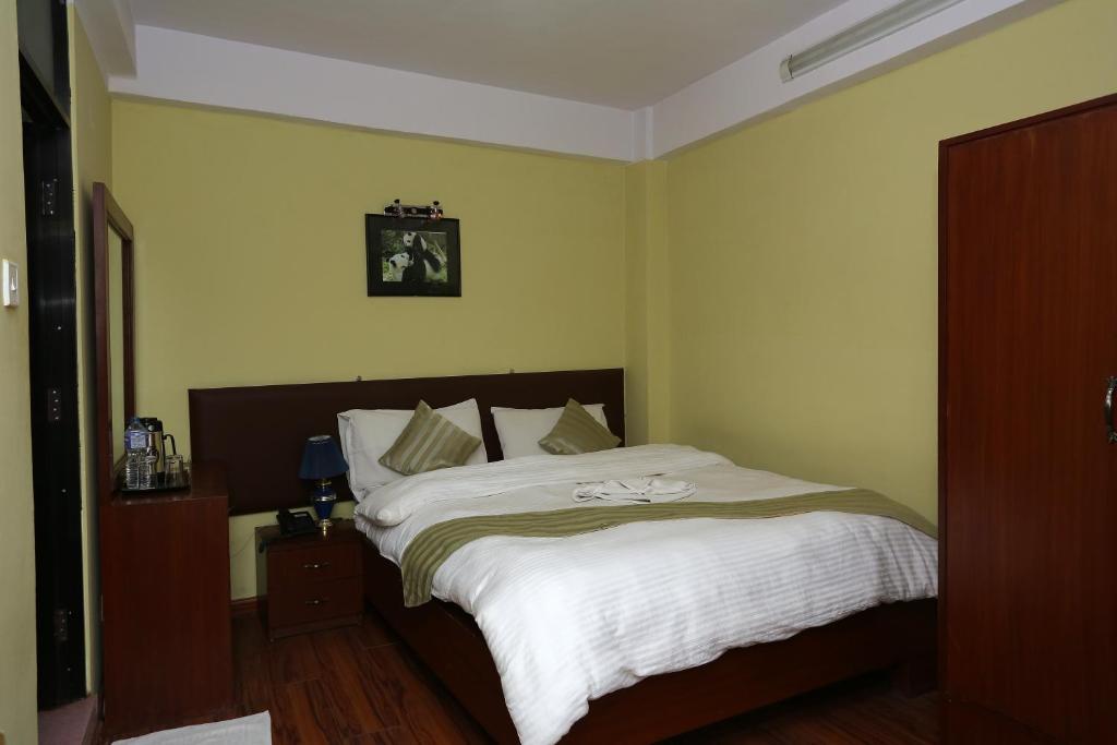 Postel nebo postele na pokoji v ubytování New Hotel Panda