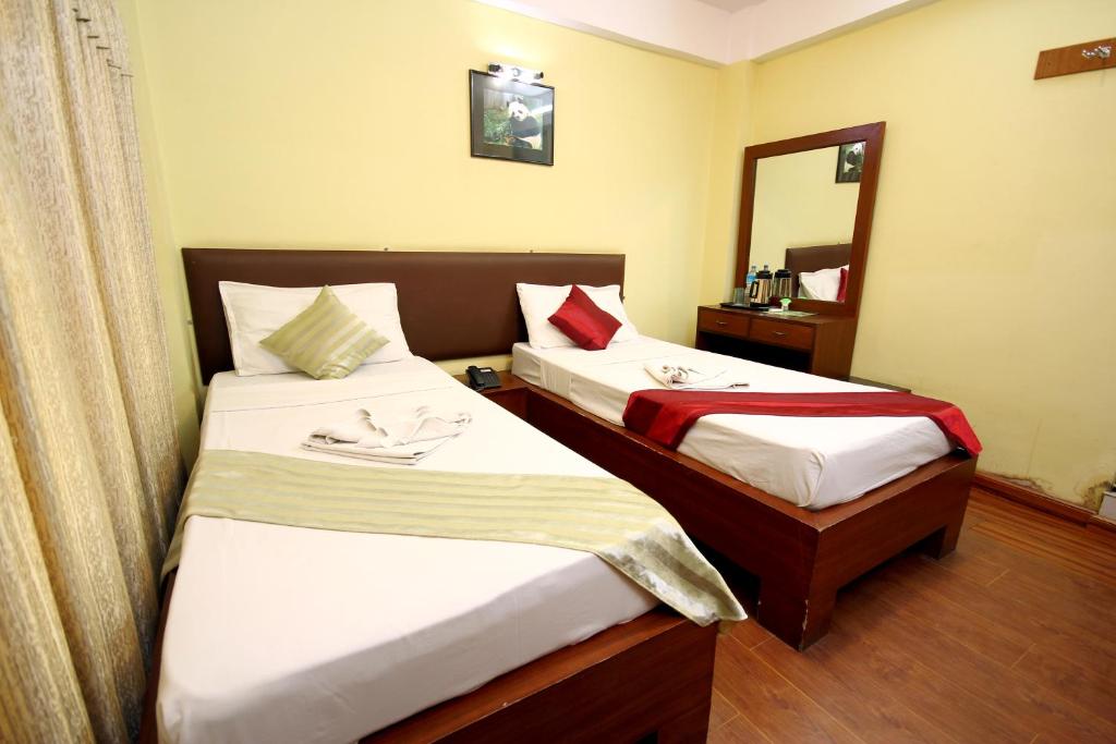 Postel nebo postele na pokoji v ubytování New Hotel Panda
