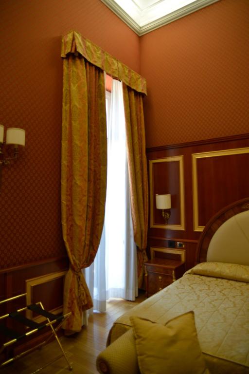 Postel nebo postele na pokoji v ubytování Livingston Hotel
