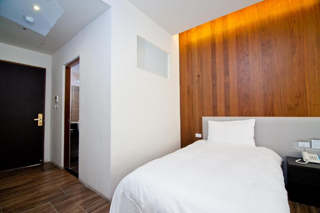 Postel nebo postele na pokoji v ubytování Hledu Hotel