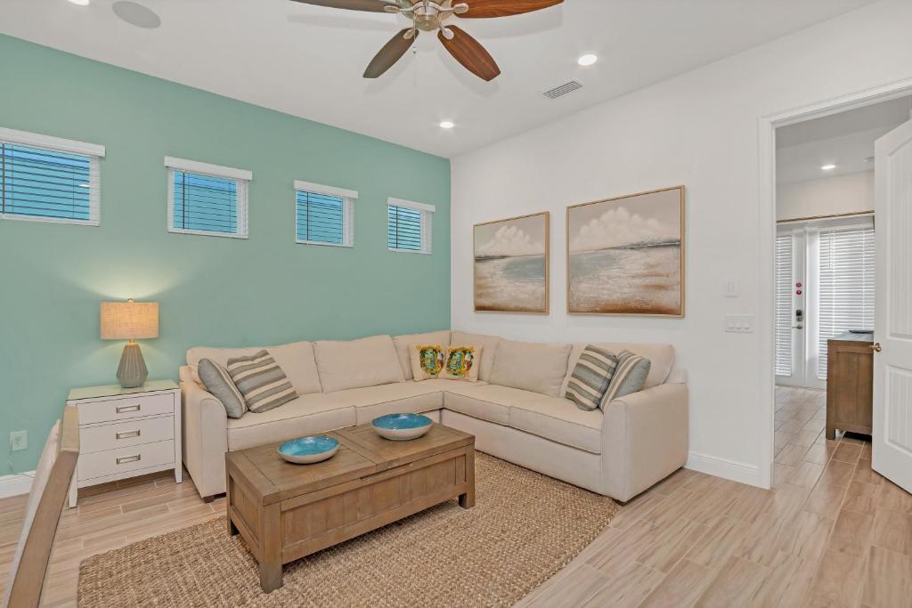 a living room with a couch and a table at Gorgeous Margaritaville Cottage wPrivate Patio in Orlando