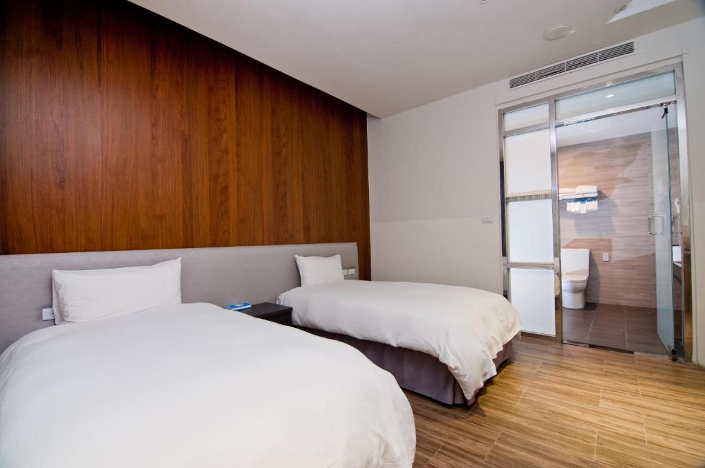 Postel nebo postele na pokoji v ubytování Hledu Hotel