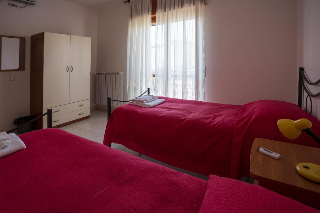 Ένα ή περισσότερα κρεβάτια σε δωμάτιο στο Casa Vacanze Isabella
