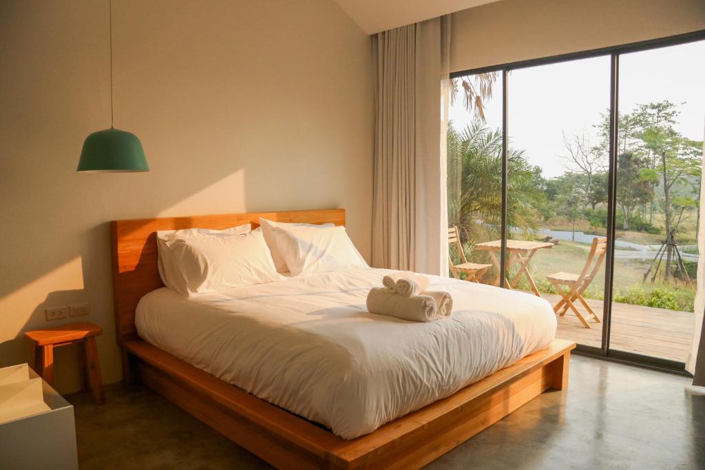 Posteľ alebo postele v izbe v ubytovaní Tubtao Sleepy Hill