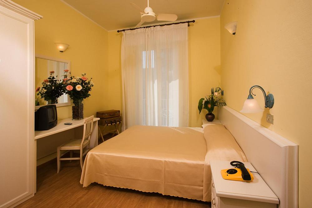 Postel nebo postele na pokoji v ubytování Hotel Plaza