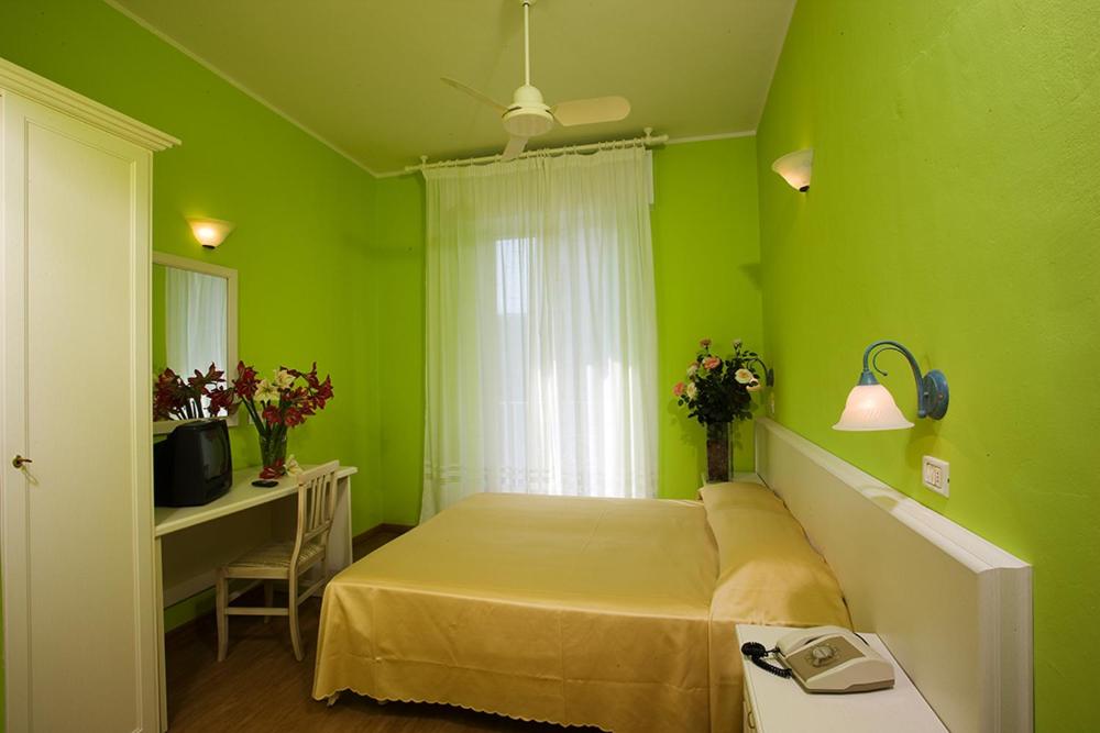 Postel nebo postele na pokoji v ubytování Hotel Plaza