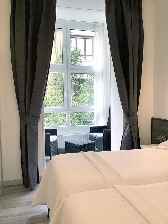 Cama o camas de una habitación en Pensión Donostiarra