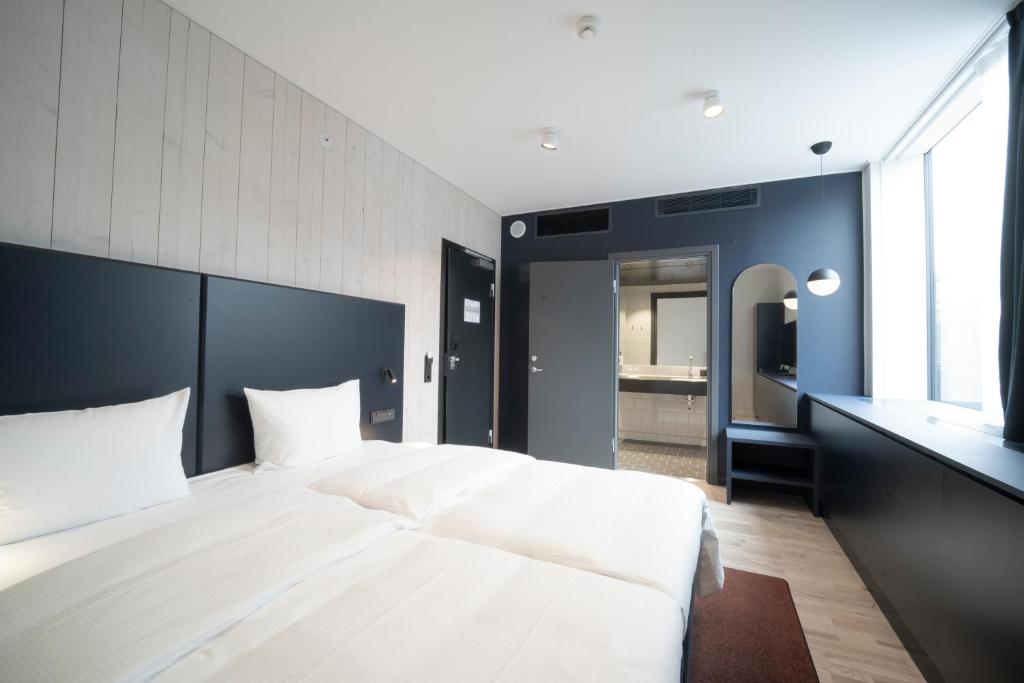 Postel nebo postele na pokoji v ubytování Quality Hotel Strawberry Arena
