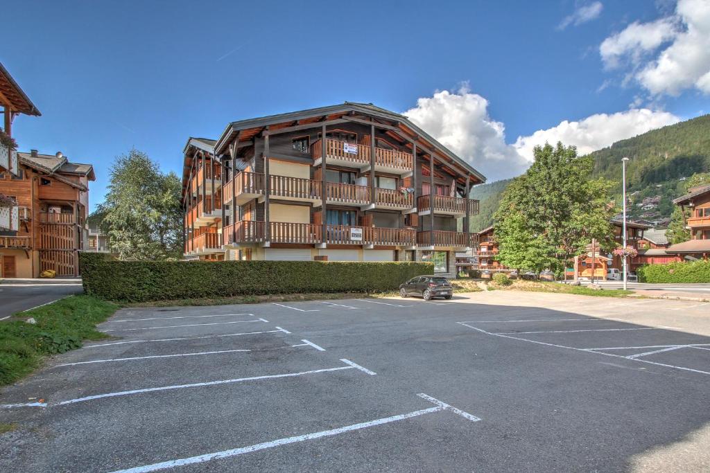 a parking lot in front of a large building at Atray C3 in Morzine