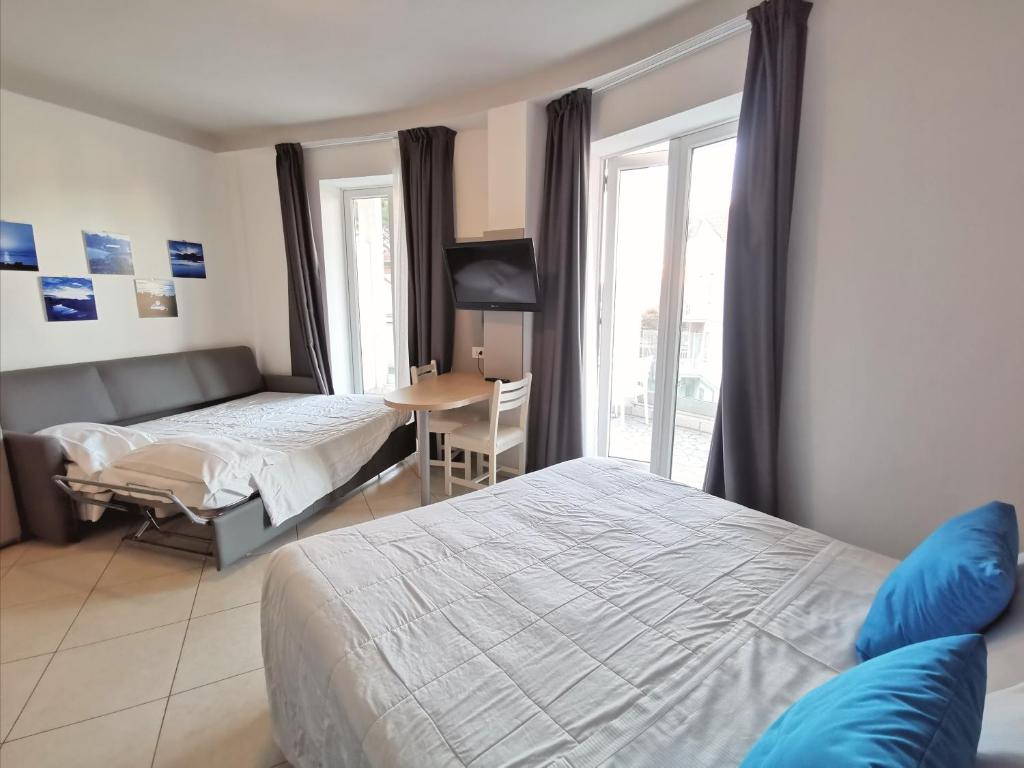 Postel nebo postele na pokoji v ubytování Hotel Oceanomare