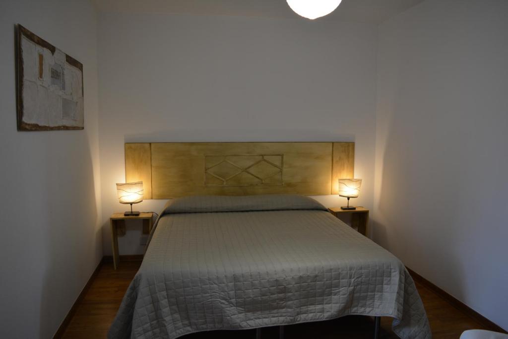 Postel nebo postele na pokoji v ubytování OLASPRI