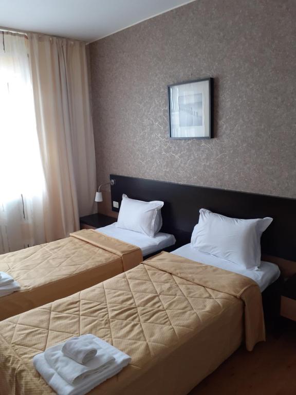 Postel nebo postele na pokoji v ubytování Hotel Nord