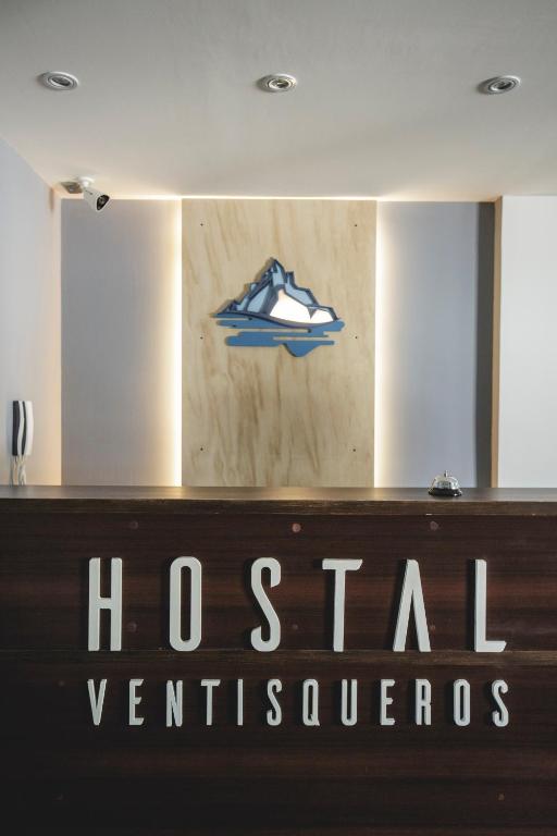 a sign for a houston vermillionres sign on a building at Hostal Ventisqueros in Punta Arenas