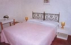 A bed or beds in a room at Hotel Aldobrandini