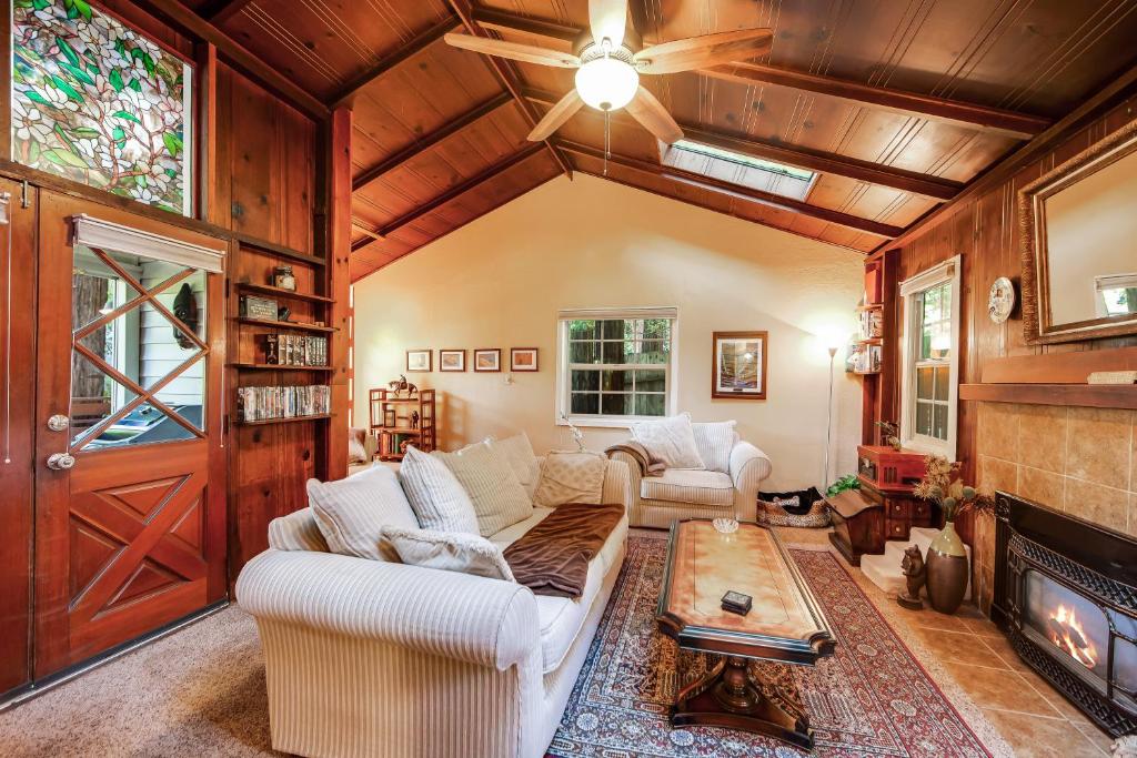 a living room with a couch and a fireplace at Home on the Range in Guerneville