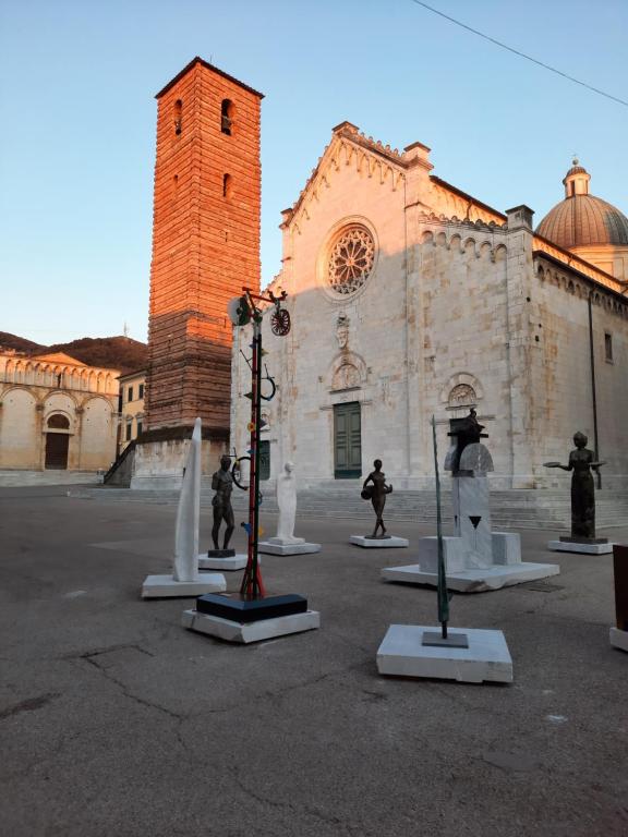 a group of statues in front of a building at Art Hotel Pietrasanta in Pietrasanta