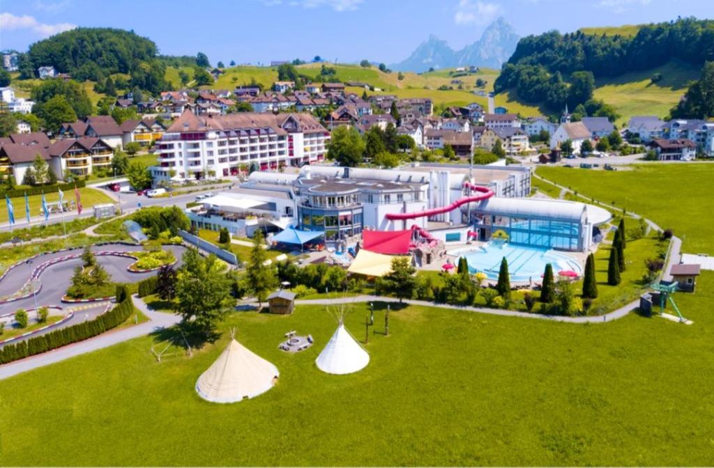 an aerial view of a resort with a pool at Studio with wifi at Morschach in Morschach