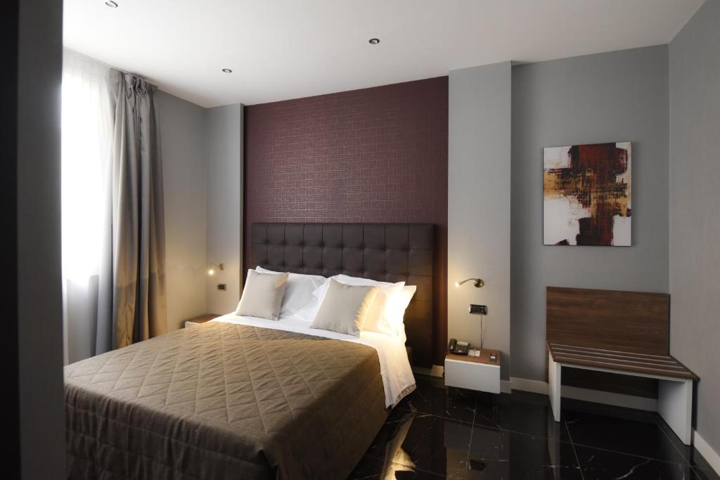 Postel nebo postele na pokoji v ubytování Magri's Hotel