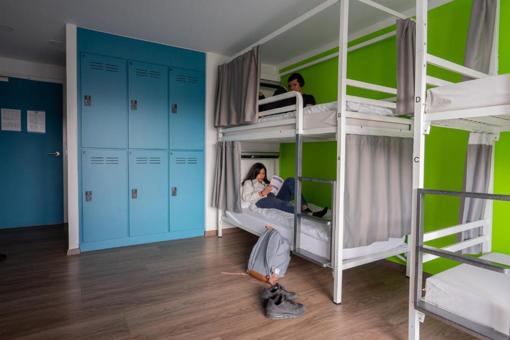 Postel nebo postele na pokoji v ubytování Nyon Hostel