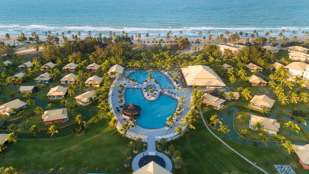 an aerial view of a resort with a pool and the ocean at Vila Galé Resort Cumbuco - All inclusive in Cumbuco