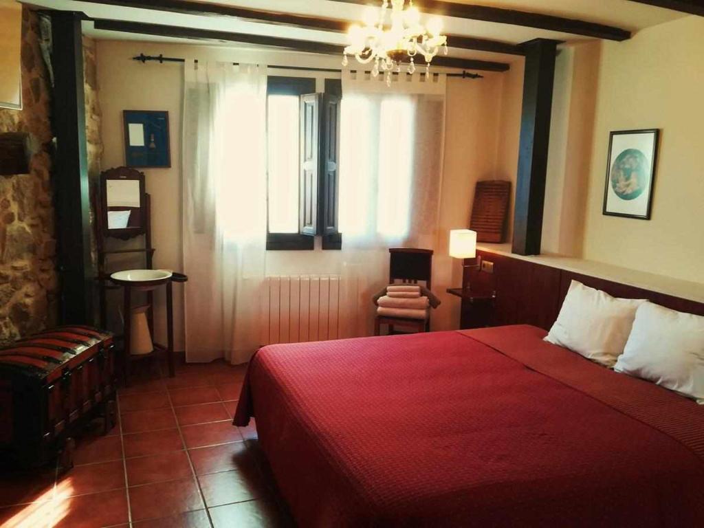 Postel nebo postele na pokoji v ubytování Casa Rural FranciaQuilamas