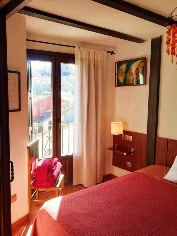 Postel nebo postele na pokoji v ubytování Casa Rural FranciaQuilamas