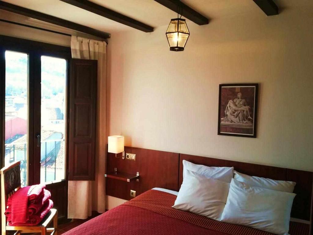 Postel nebo postele na pokoji v ubytování Casa Rural FranciaQuilamas