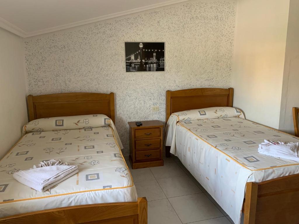 Postel nebo postele na pokoji v ubytování Hostal Sequeiros